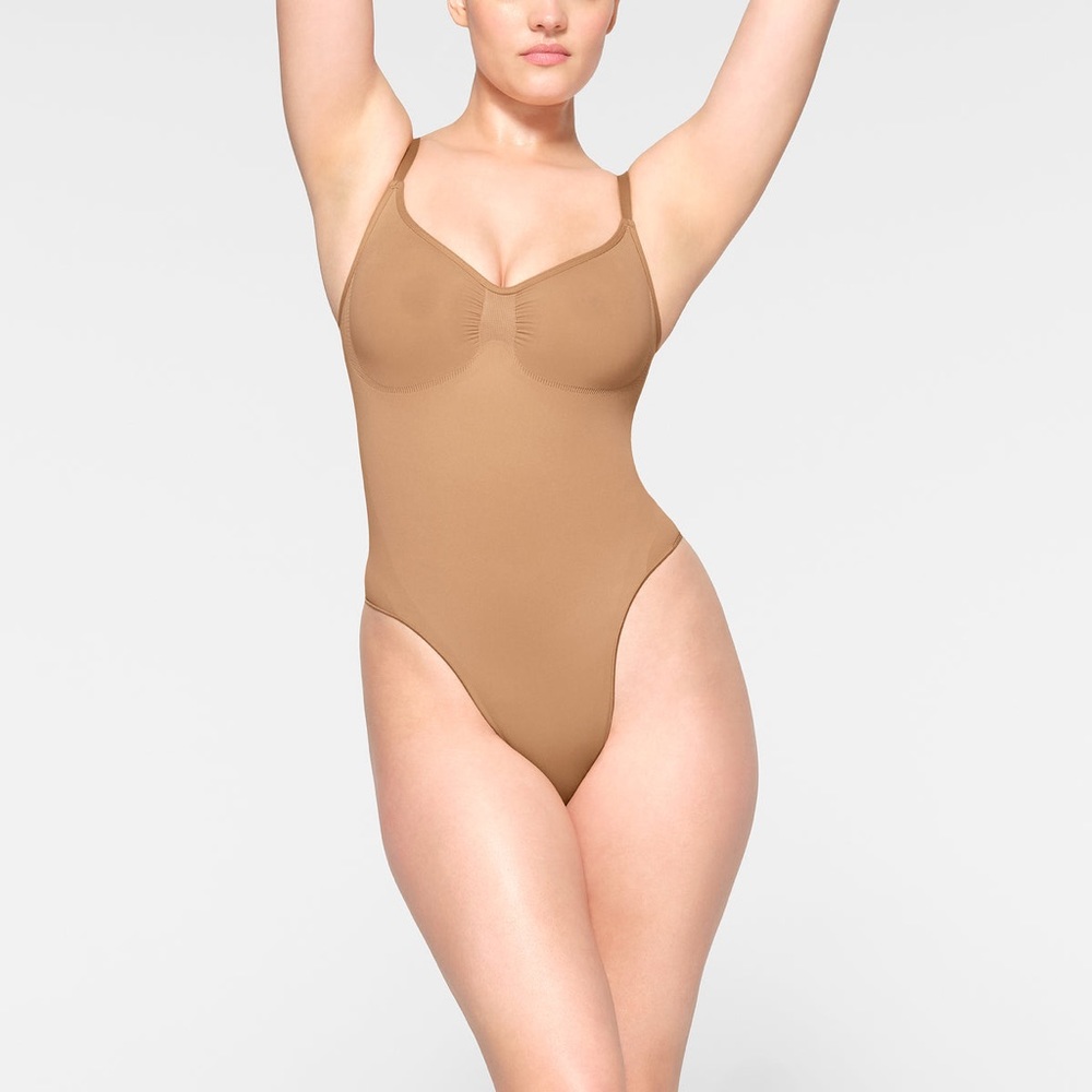 SKIMS seamless sculpt thong body suit, color Ochre, size M